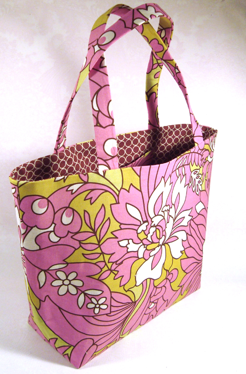 a flowered bag that is sitting on the ground