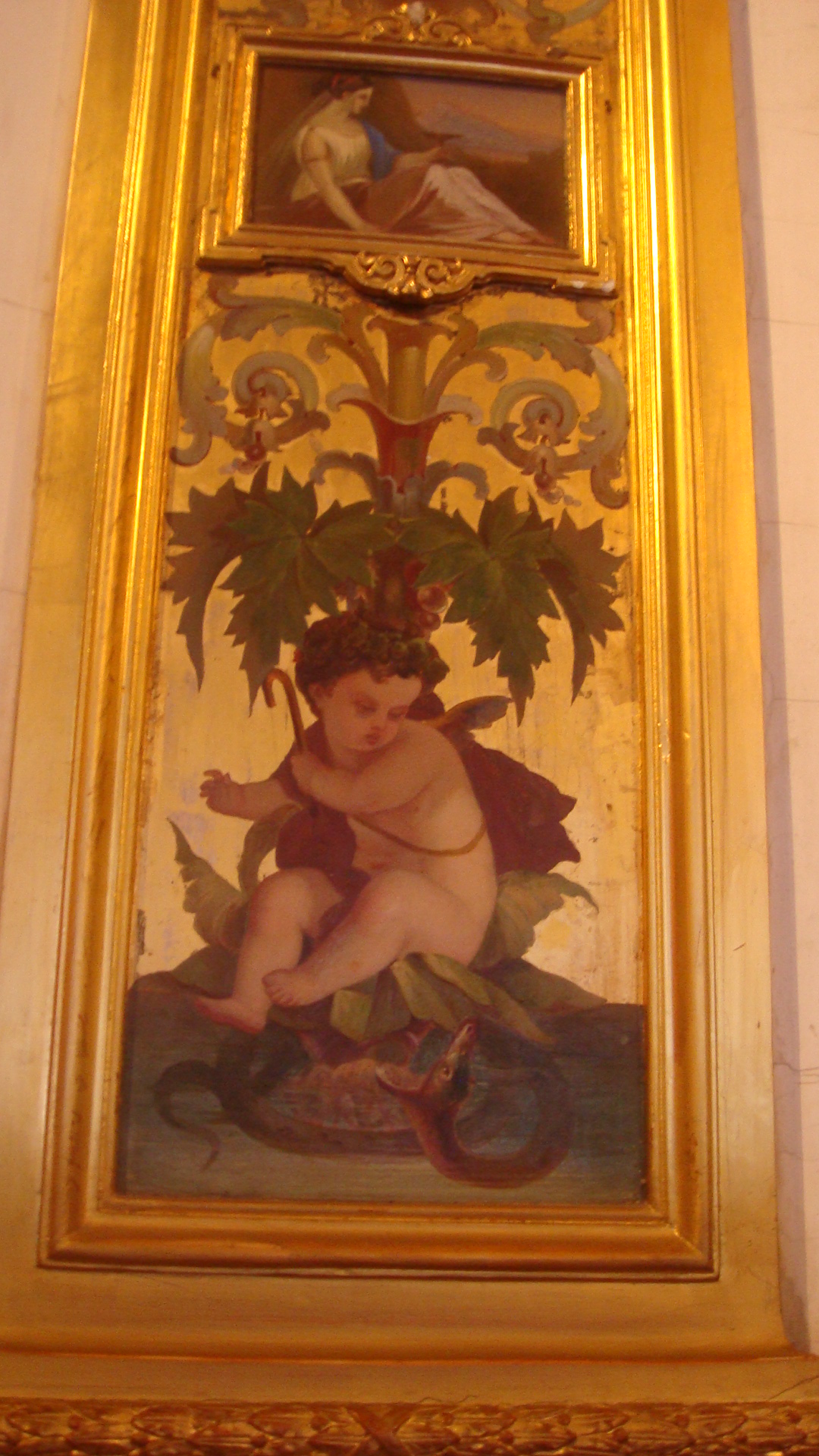 a painting on the wall is shown in a gold frame
