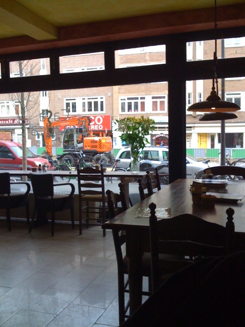 a picture of a restaurant looking out onto the street