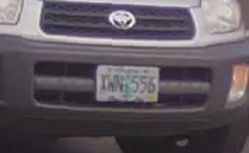 a front end of a car with a license plate