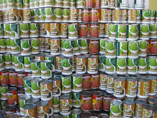 a couple of canned vegetables in cans stacked together