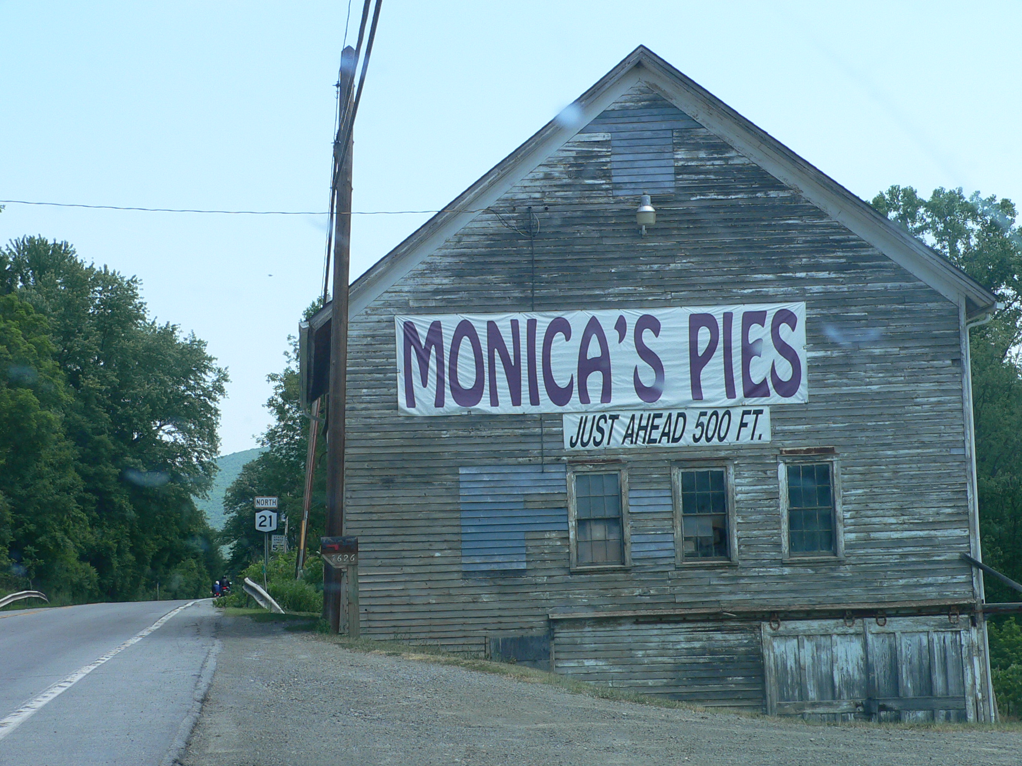 a business sign on the side of an old building