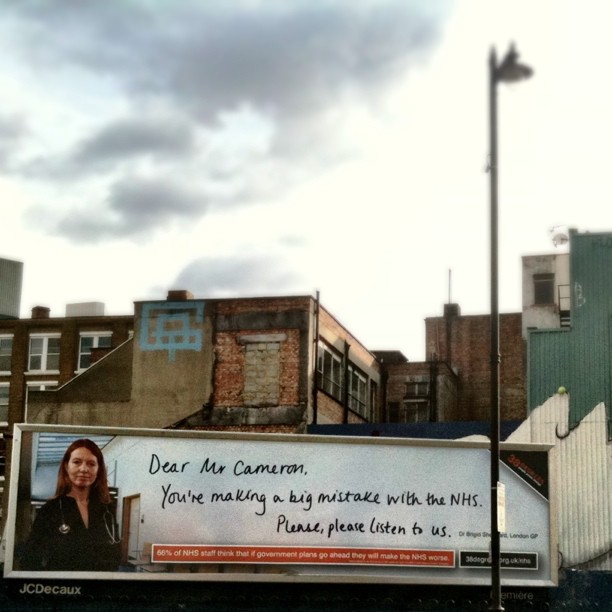 an advertit on a city street for women