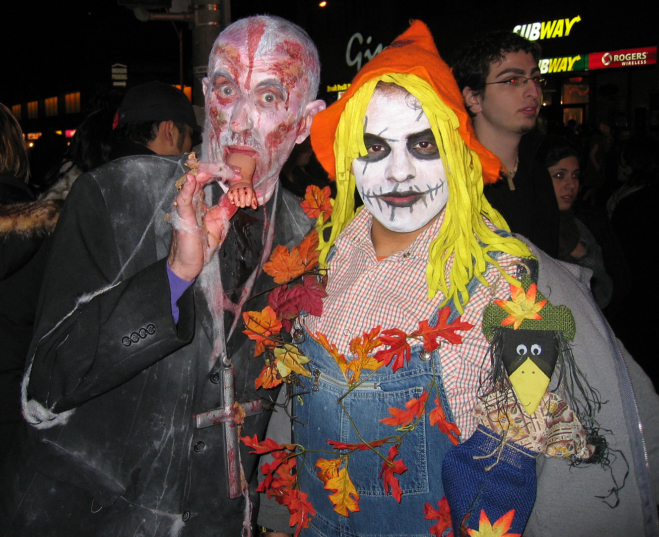 two people are dressed as scary clowns and witch
