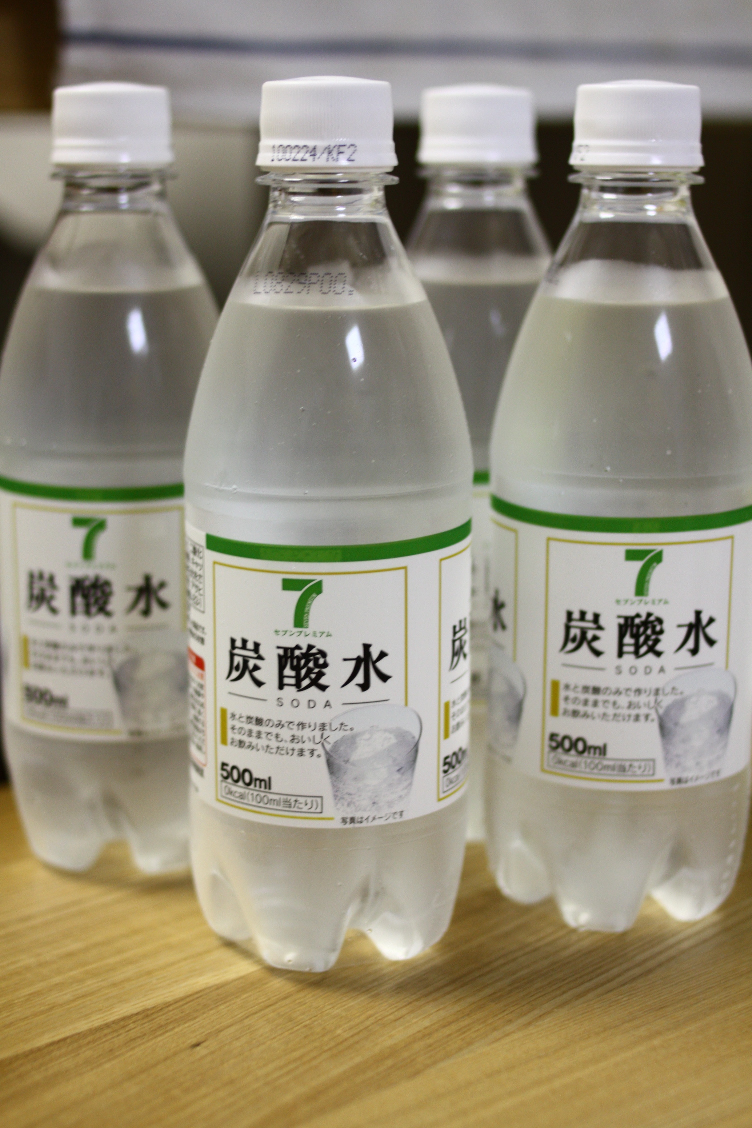 three bottles of water with an inscription on each