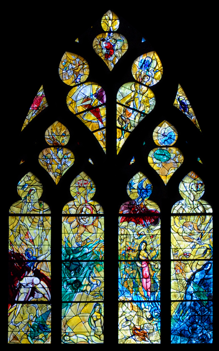 a very large stain glass window with a nice decoration