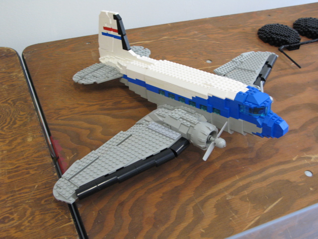 a toy plane is made out of legos