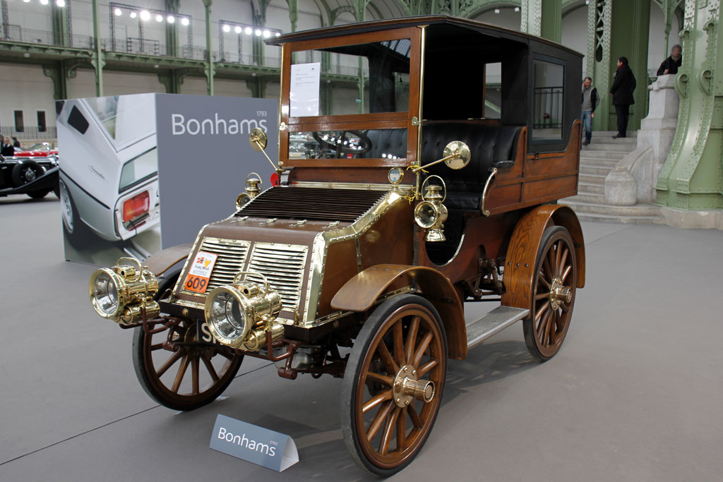 an old brown vehicle in a museum