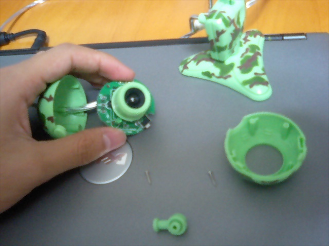 someone uses a device to cut the inside of a toy