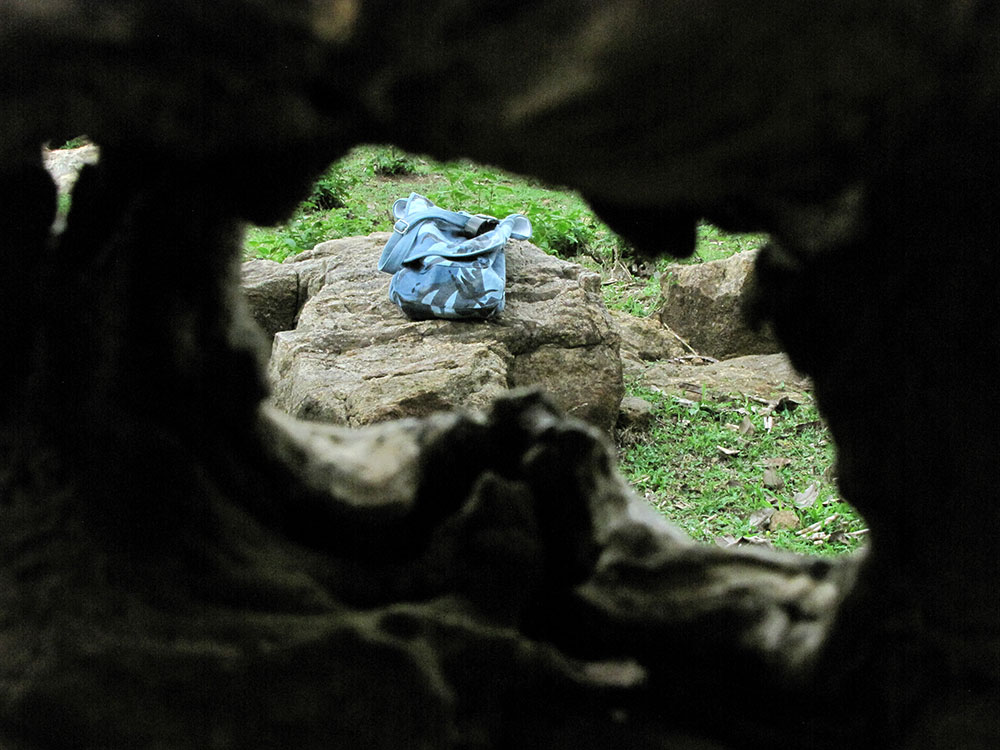 a bag lies on some rocks in the wilderness