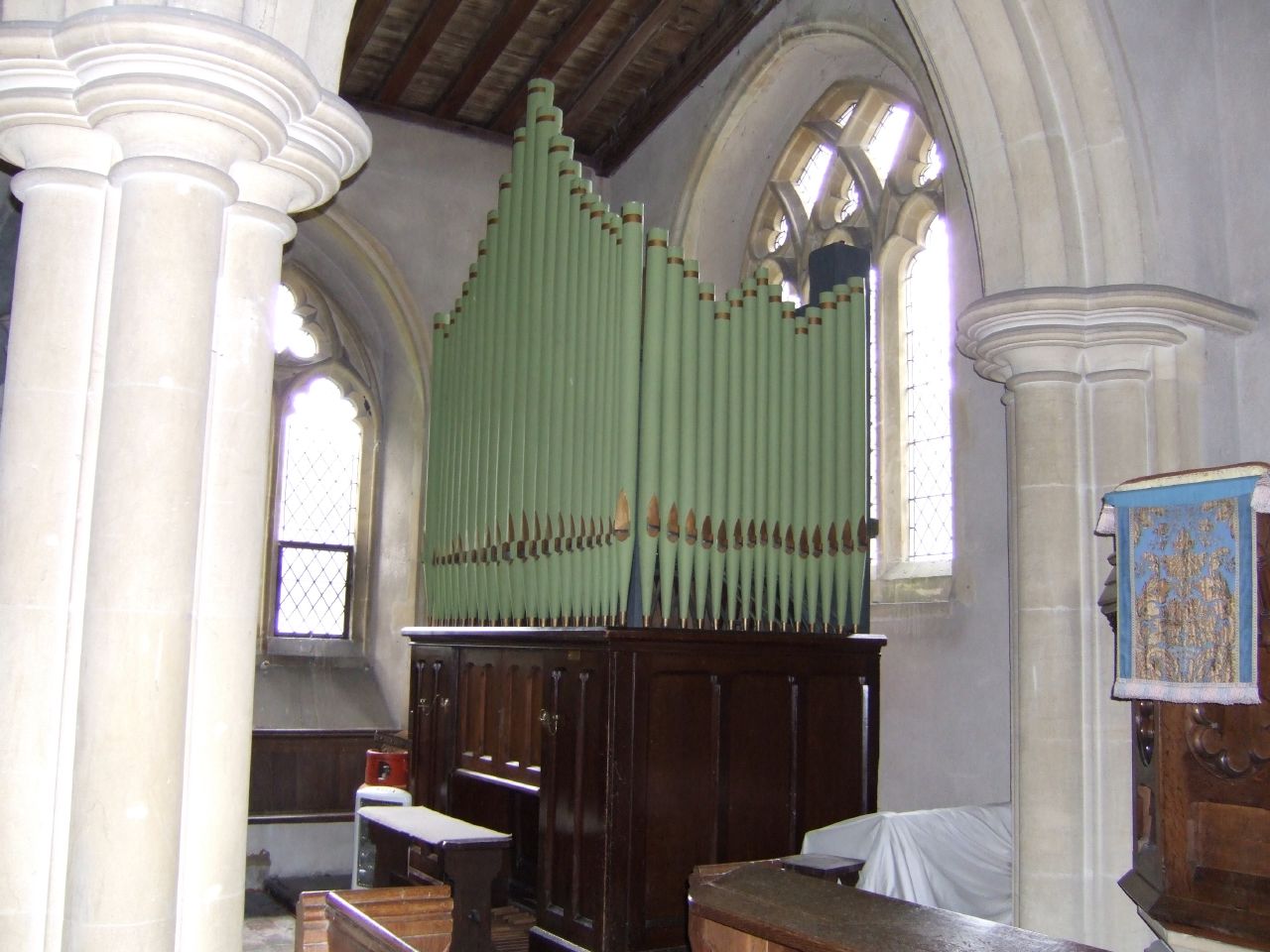 the pipe is in front of the church alter