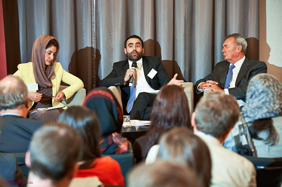 people in a room, all wearing business suits