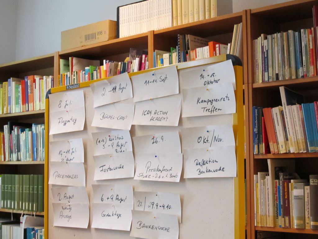 an organized wall of books and notes on them