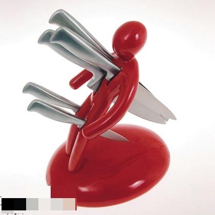 a red object with a knife in it and other knives attached to the handle