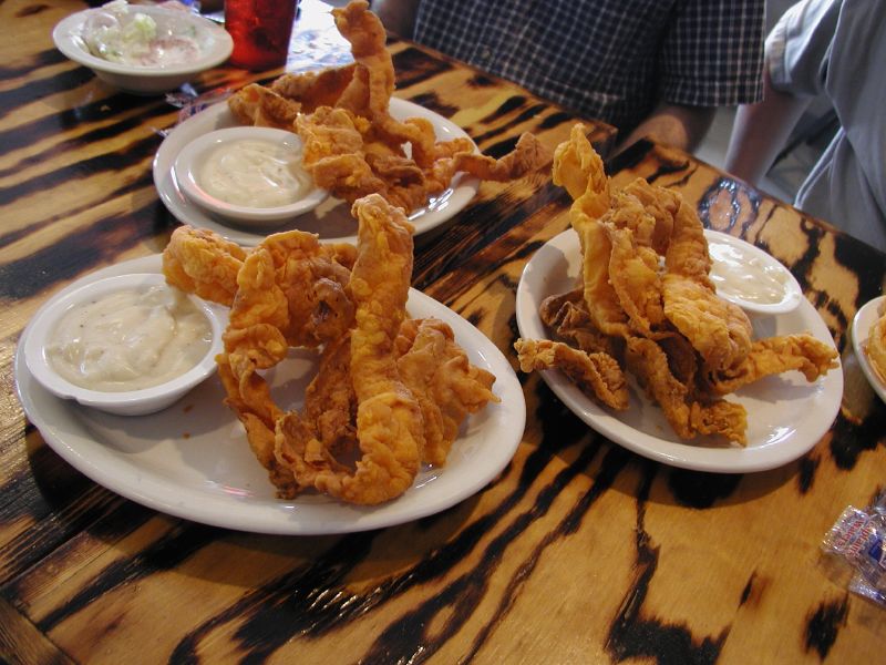 various plates with food items on them on a table