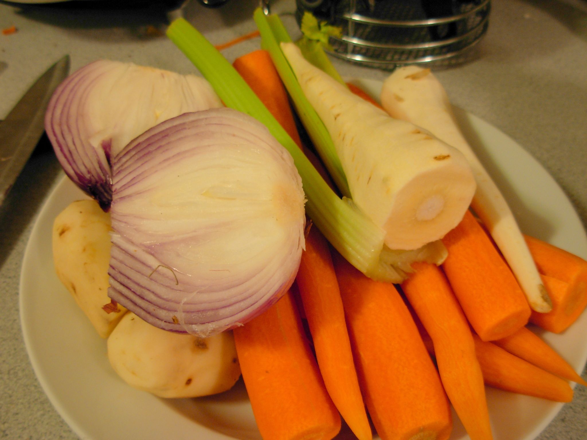 some onions and carrots on a plate