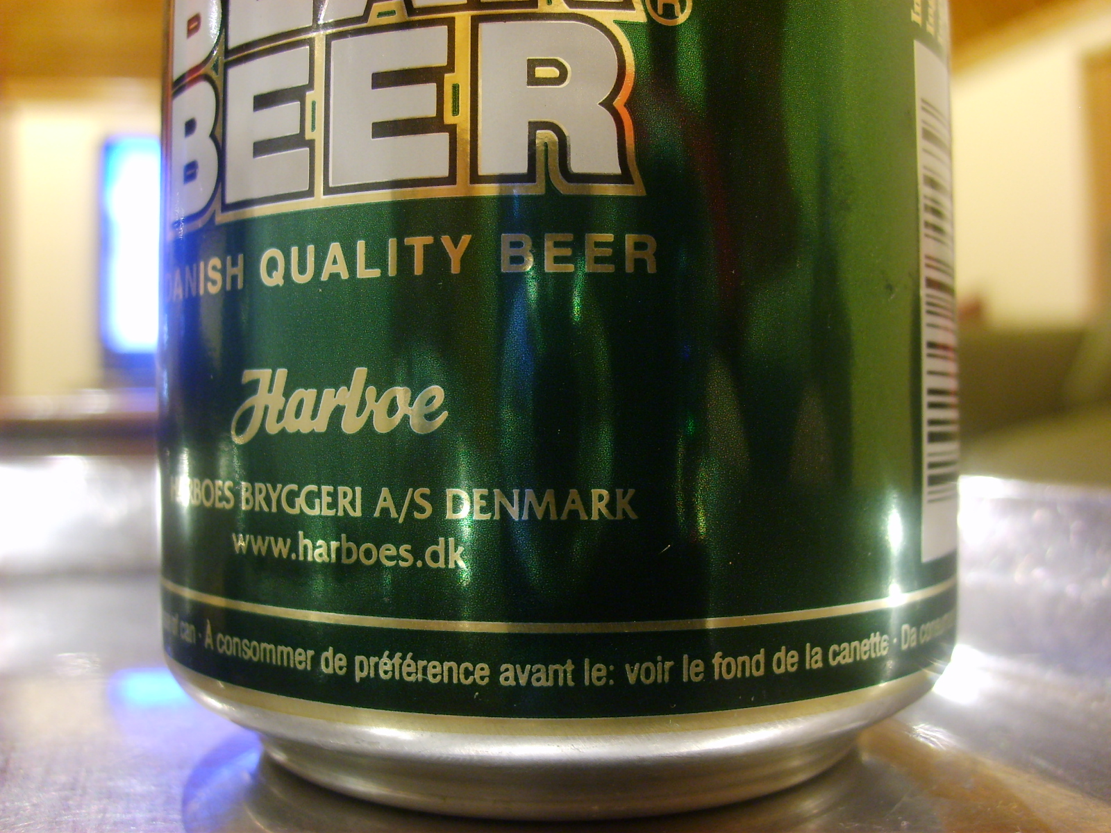 a can of beer sitting on top of a table