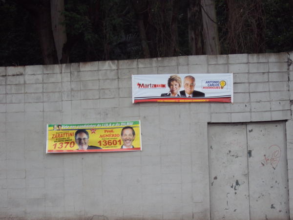 political billboards advertise different roles on the wall