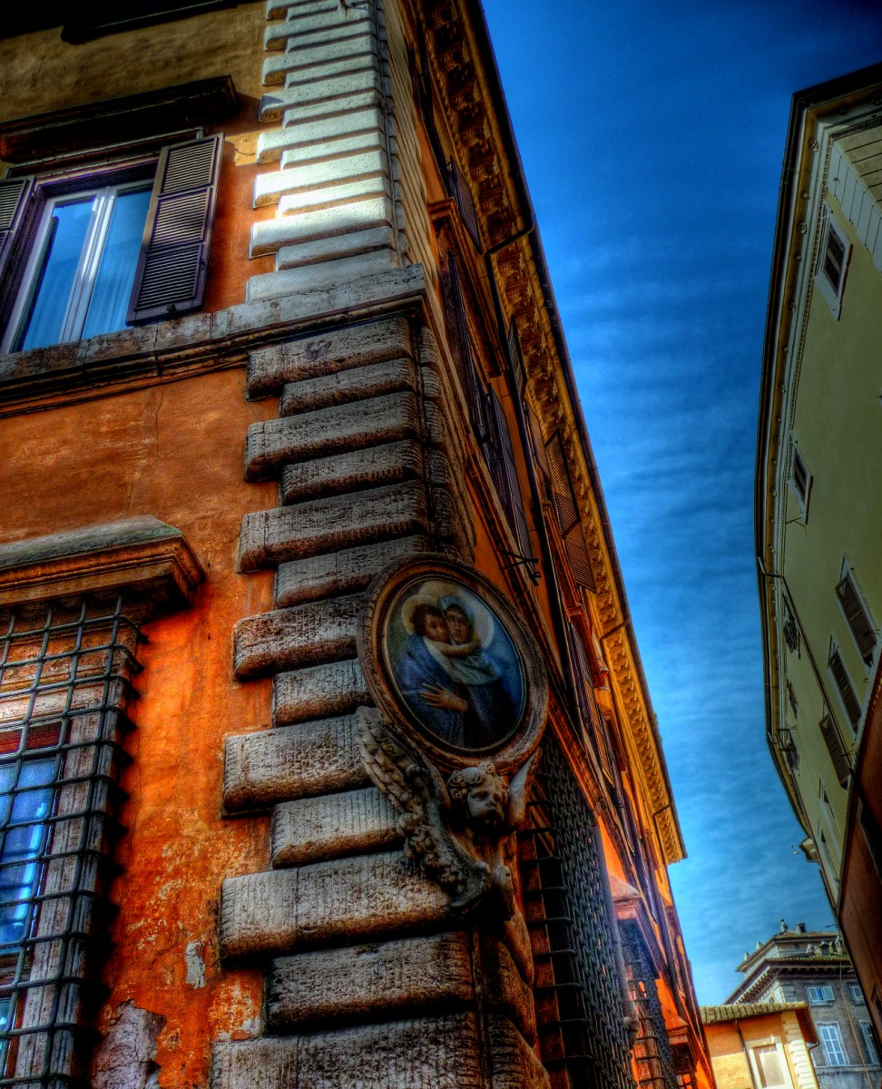 an old building with a round window and stained glass in the side