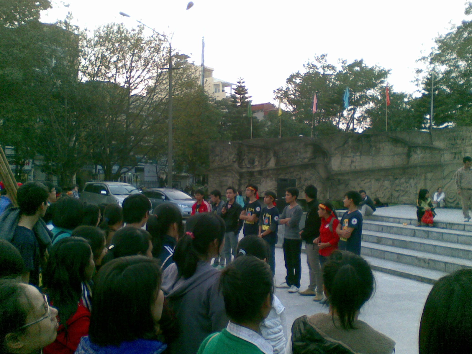 a large group of people gathered outside at the steps