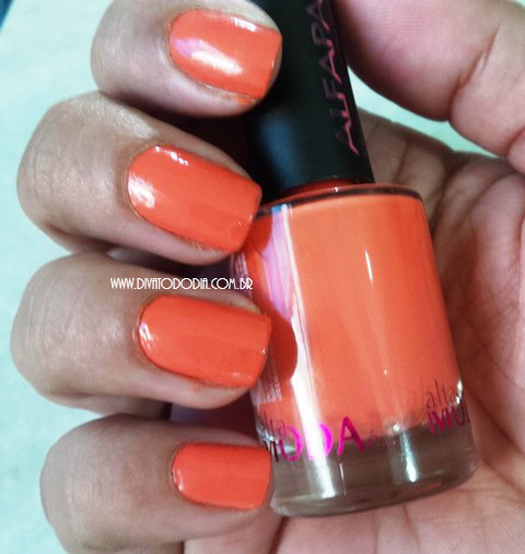 orange nail polish with black tips and orange nails