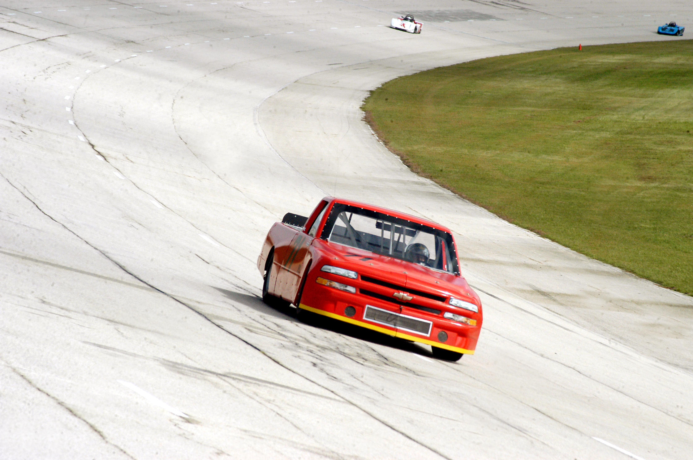 the race truck is driving on the track