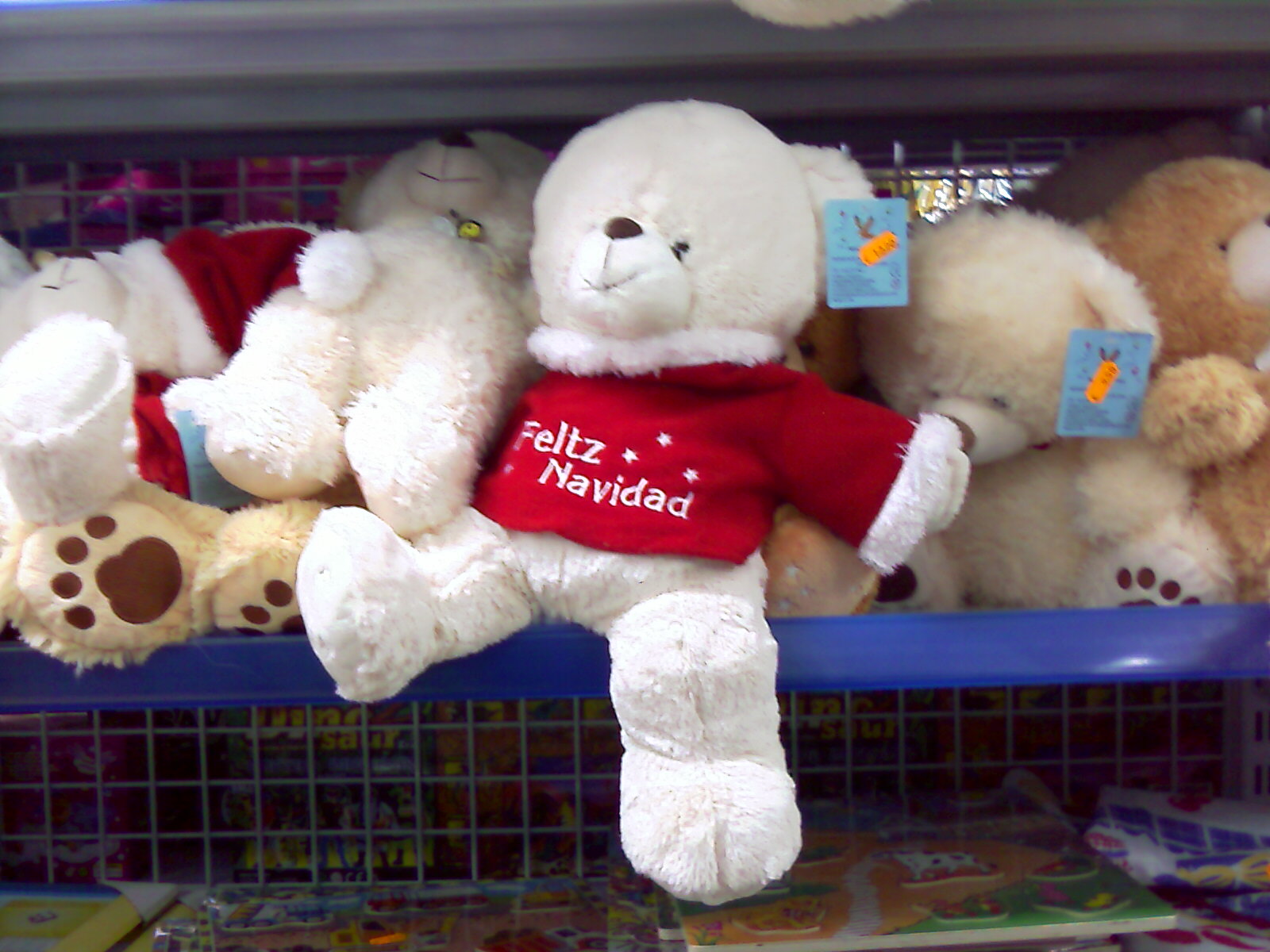 a shelf in a store with some stuffed animals