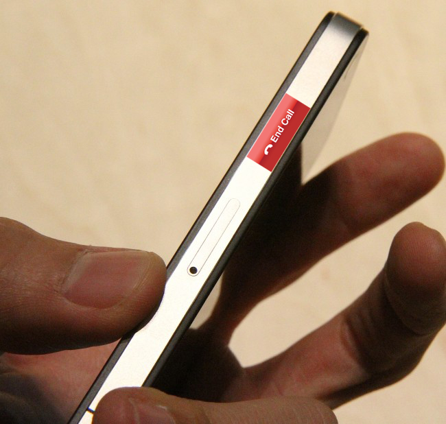 a person holds onto a tiny smart device