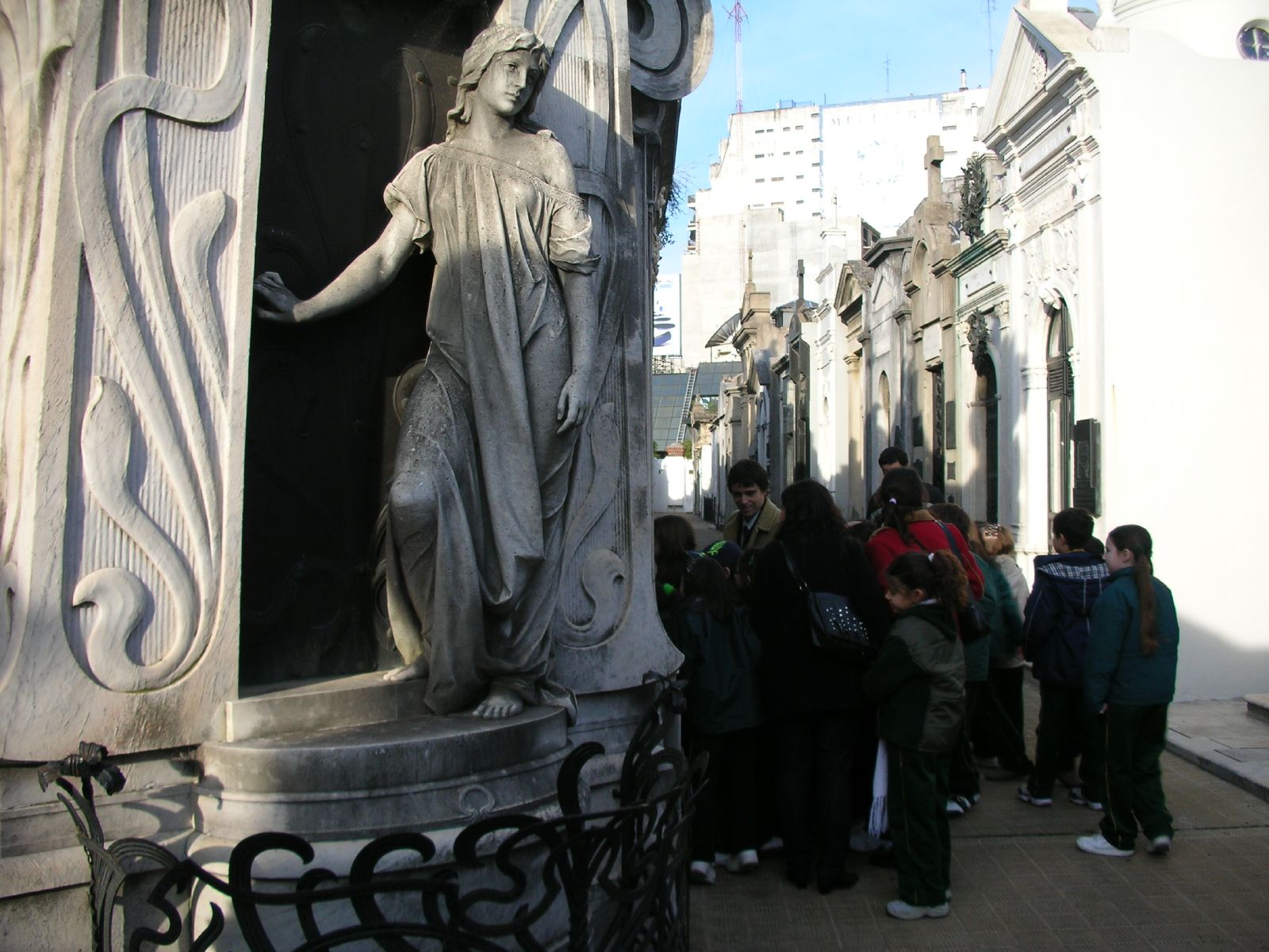 a statue that is standing in the middle of a building