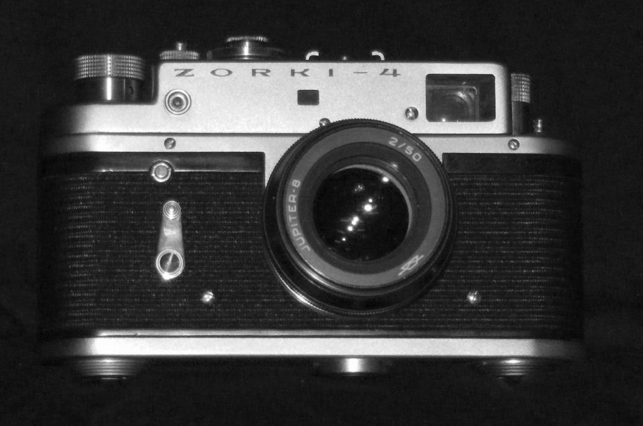an old looking camera is in the dark