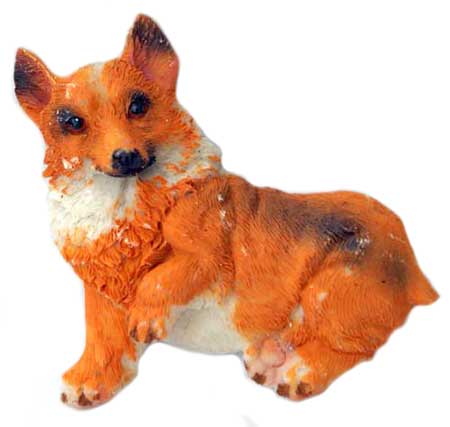 a figurine of a red dog sitting down