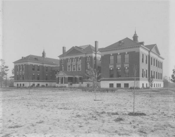 an old po shows several large brick buildings