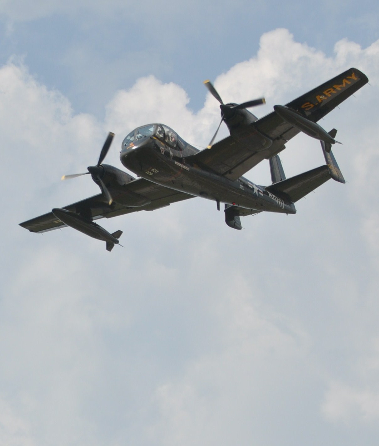 a small propeller plane flying in the sky