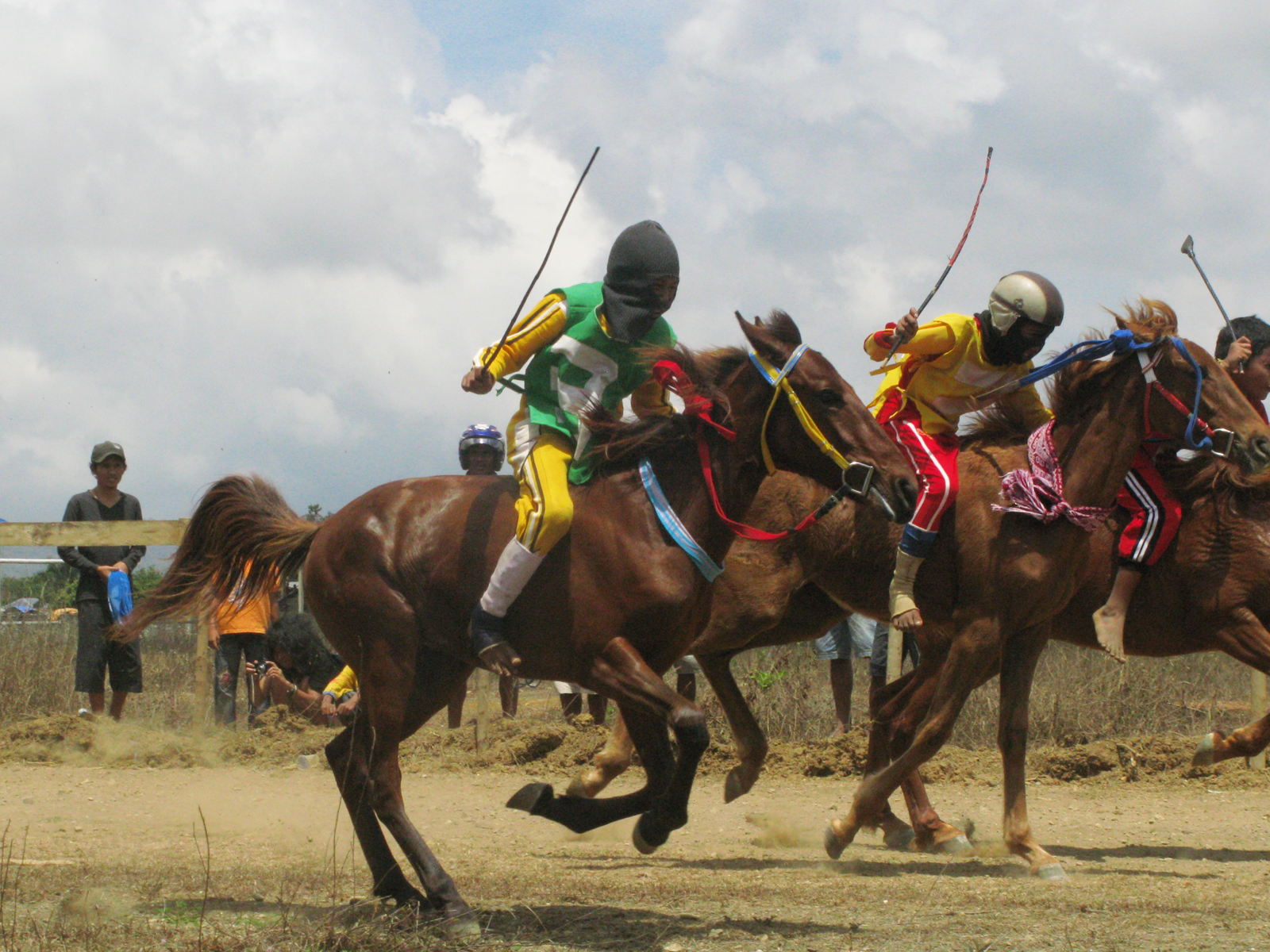 jockeys are being ridden horses in a competition