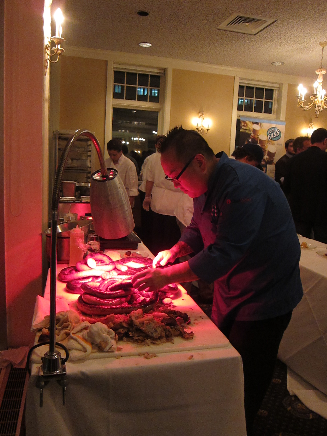 a chef prepares food on a large white table