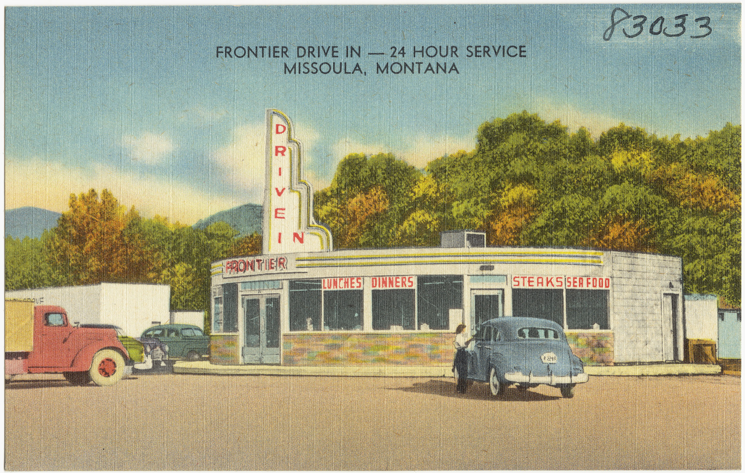 a postcard with two trucks and some buildings