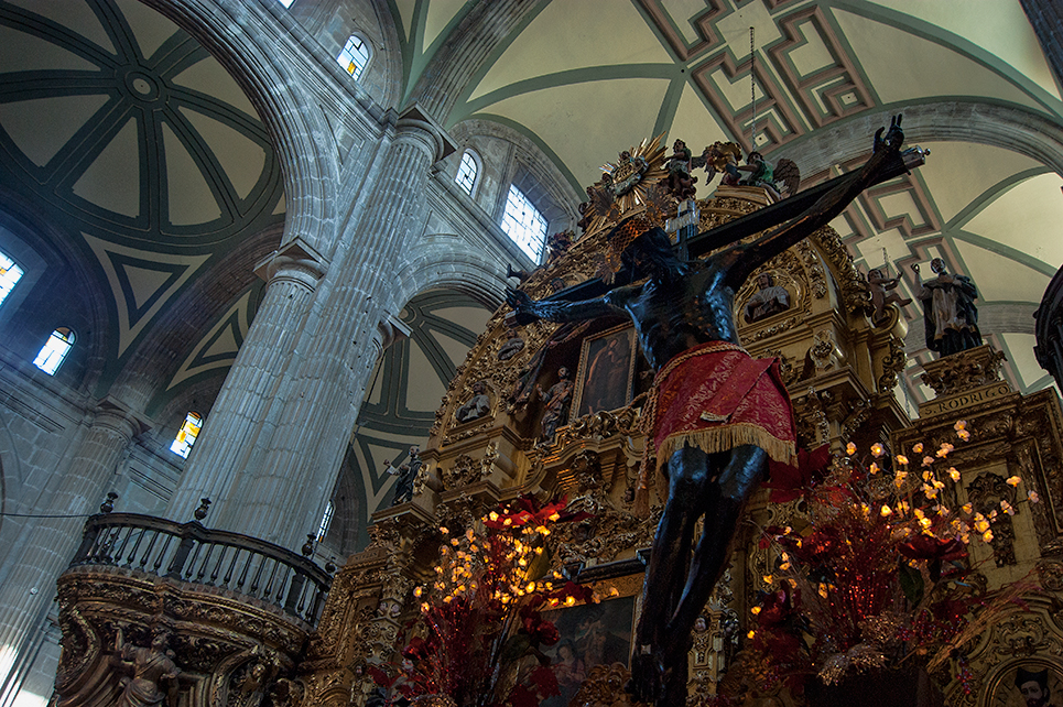 a statue of jesus on display in a cathedral