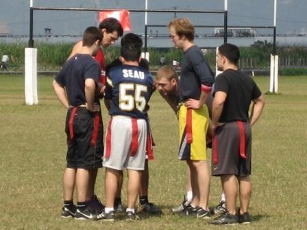 a group of boys are playing a game of football