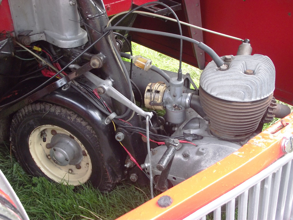 an old engine and its power steering on the grass