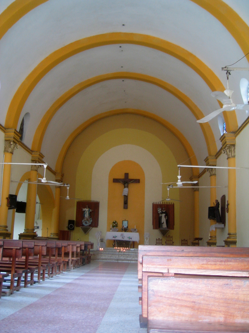 the inside of an empty church with rows of pews