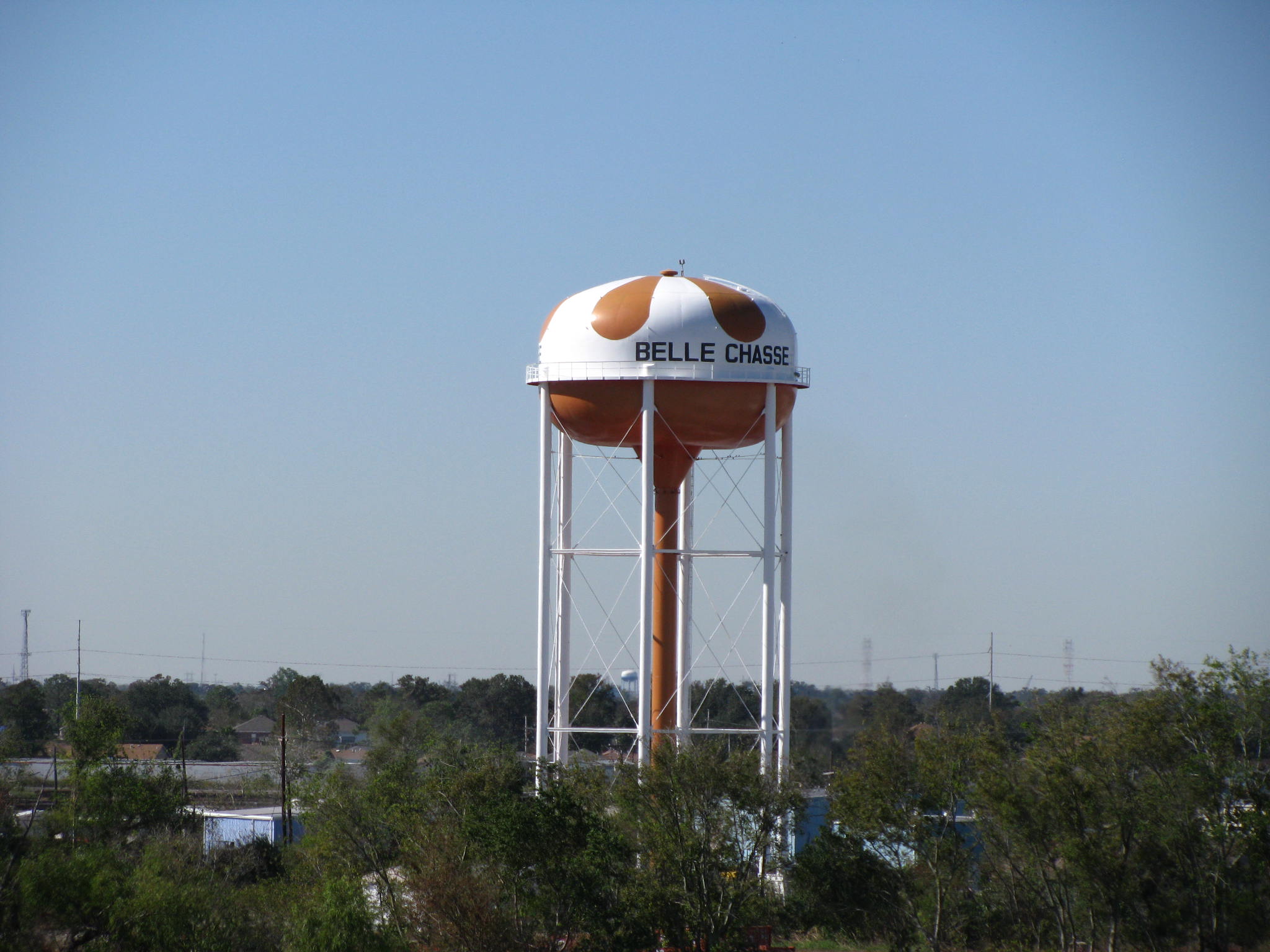 a tall water tower with a large sign on top