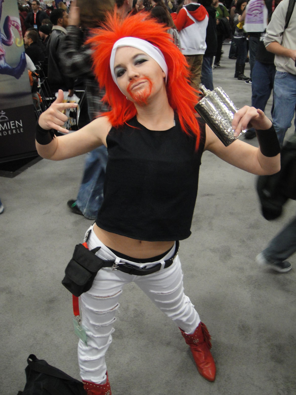 a woman with red hair wearing white and black makeup