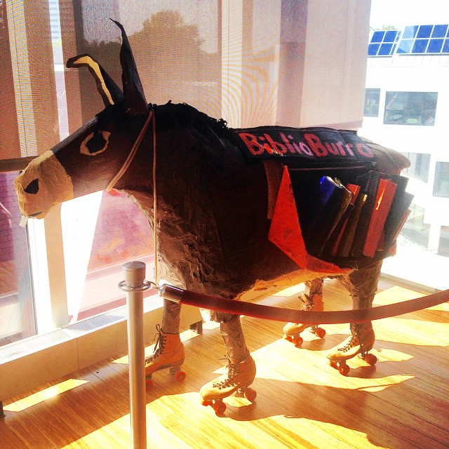 a cow with a tie and a jacket
