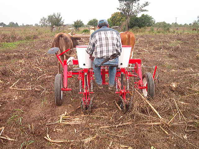 a farmer is working in the field on his tractor