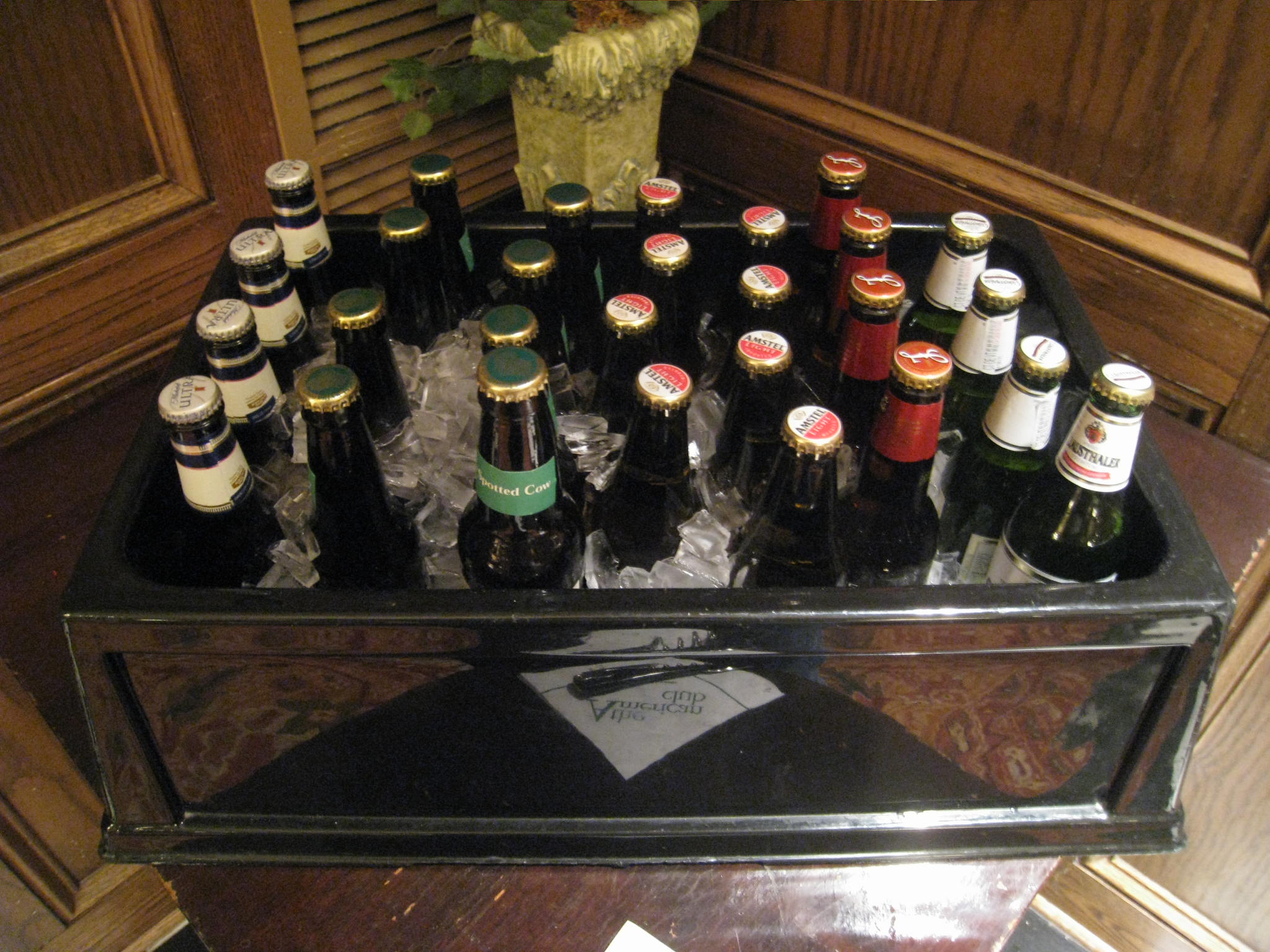 a wooden chest holding lots of bottles