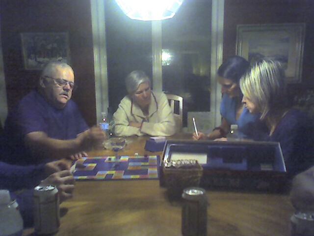 adults playing board games while seated at table