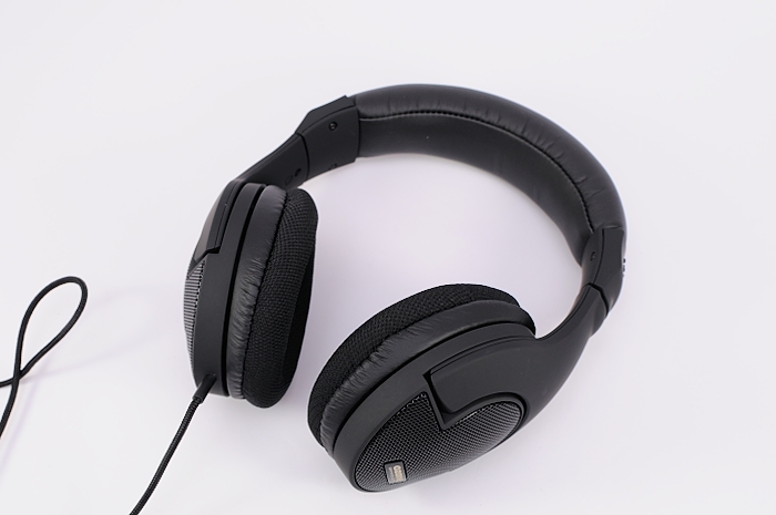 headphones with microphone attached are sitting on a white background