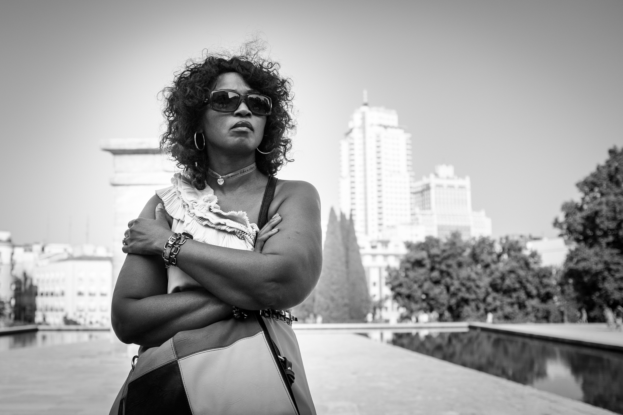 black and white po of a woman wearing sunglasses