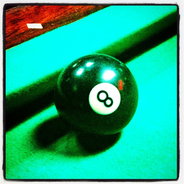 a pool ball sitting on top of a green table