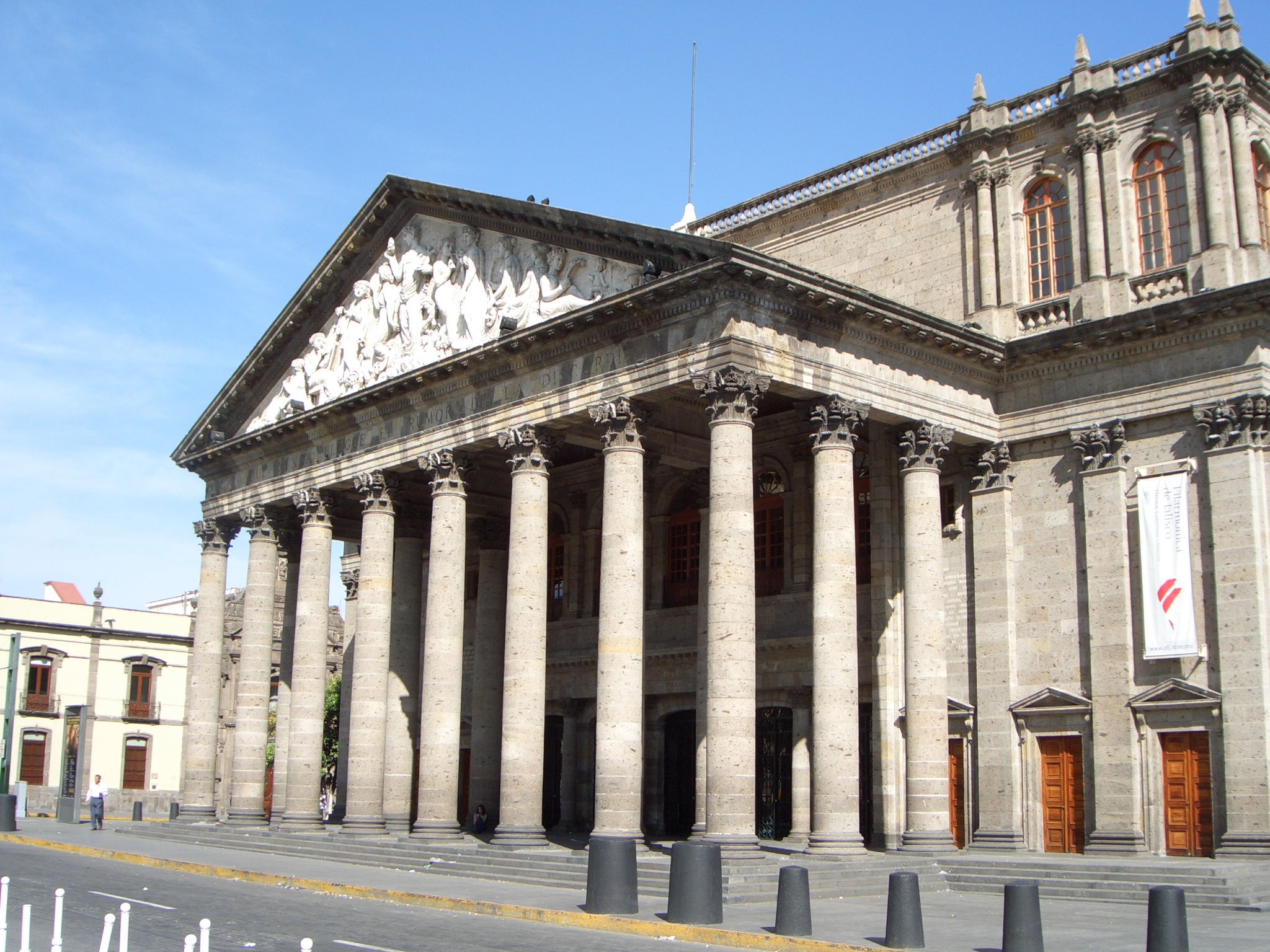 an old brick building with many columns and arches